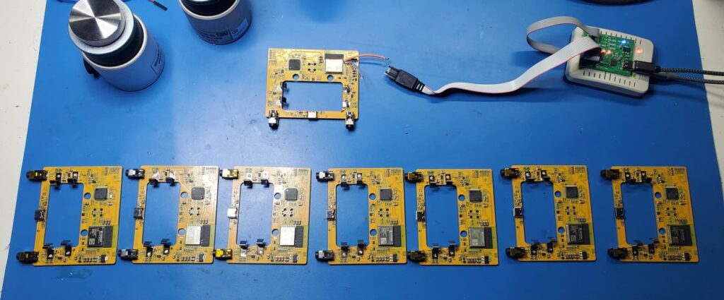 8 prototype boards being programmed.