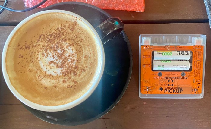 Production Pickup board in orange next to a pumpkin spice latte.